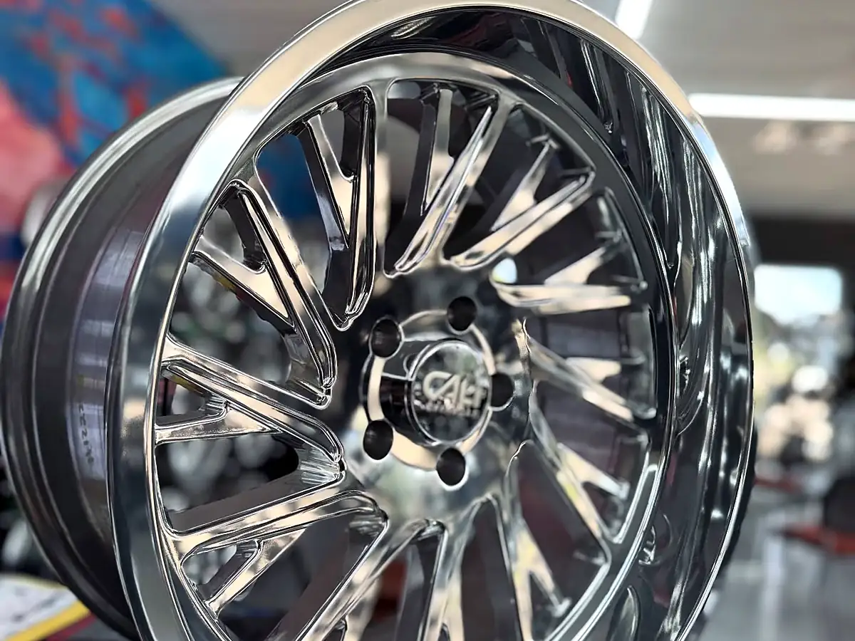 Polished 20x10 Cali Off-Road Purge wheel with a deep lip in the Wheels Up Front Tyler showroom