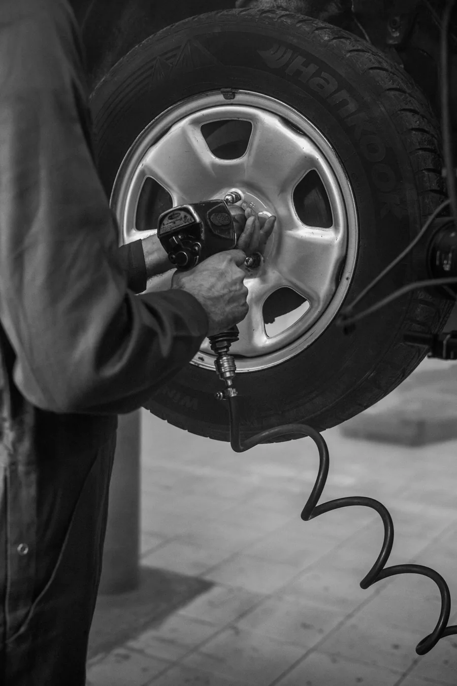Wheels Upfront technician torquing a wheel with a hand wrench