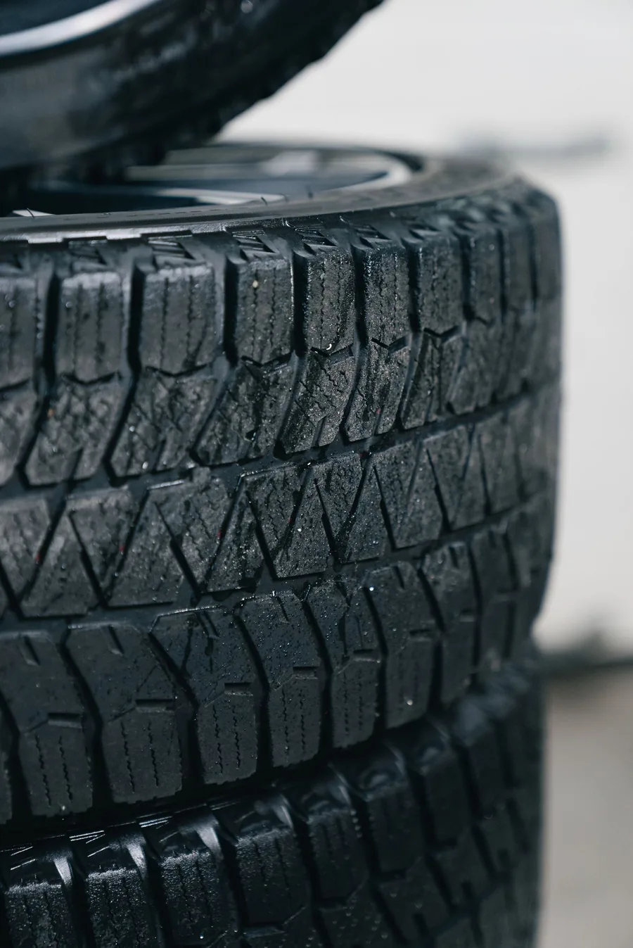 Stack of new all-terrain tires in the Wheels Upfront shop